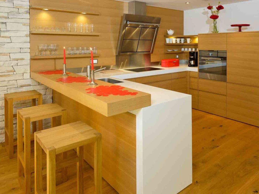 Open kitchen with its cooking part and bar
